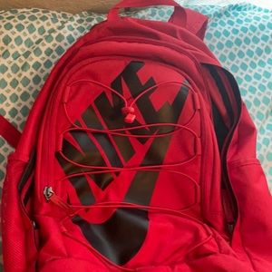COPY - A red Nike backpack perfect for back to sc…